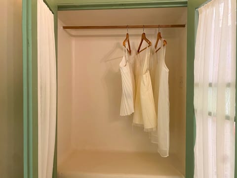 Bright open closet space with hangers and natural light