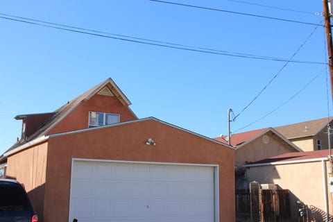 View from alley.  Enter gate to the right of the garage to enter backyard and to enter home.