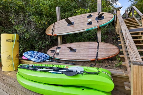 Kayaks and paddleboards ready for your next waterfront adventure