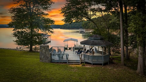 Private lakeside deck, gazebo, and dock with breathtaking sunset views