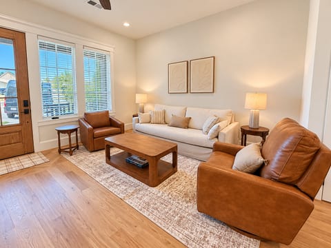 Bright, stylish living room with cozy seating and abundant natural light