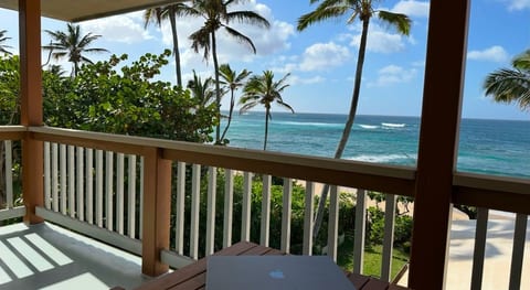 Ocean-view lanai with a table for working or relaxing outdoors.