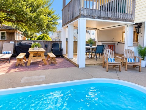 Enjoy your private pool just steps from a shaded outdoor dining area, with plenty of seating for laid-back family time.