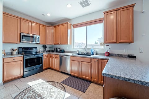 Bright kitchen with stainless appliances and generous counter space