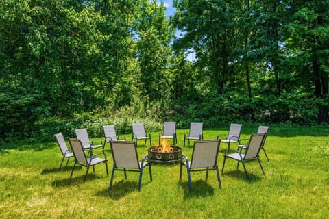 Fire pit surrounded by 12 chairs