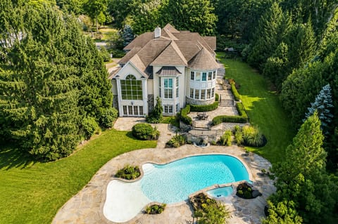 Private estate with resort-style pool, spa, and lush wooded surroundings