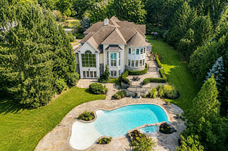 Private estate with resort-style pool, spa, and lush wooded surroundings