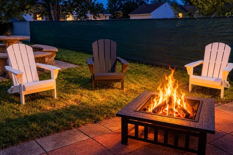 Cozy backyard fire pit with Adirondack seating for relaxing evenings
