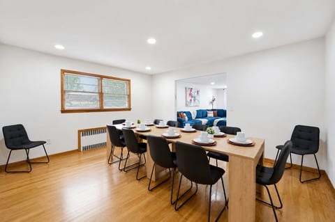 Bright dining area with seating for 8 and open flow to the living room
