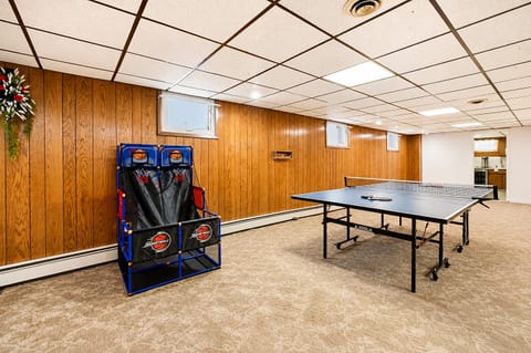 Spacious game room with ping pong and arcade basketball fun