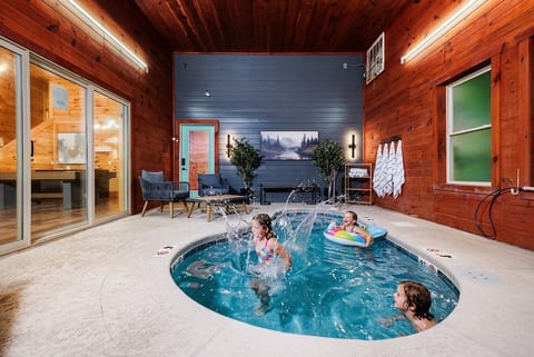 Private indoor plunge pool with cozy lodge-style ambiance