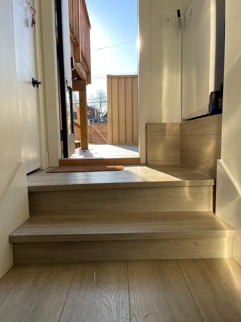 Steps into suite.