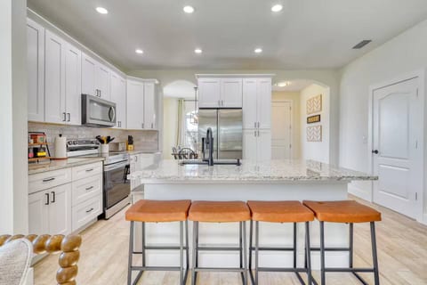 Large area to prepare meals, double door refrigerator and freezer, reverse mount sink with dish washer, oven, plenty of storage space and remote soap dispenser 