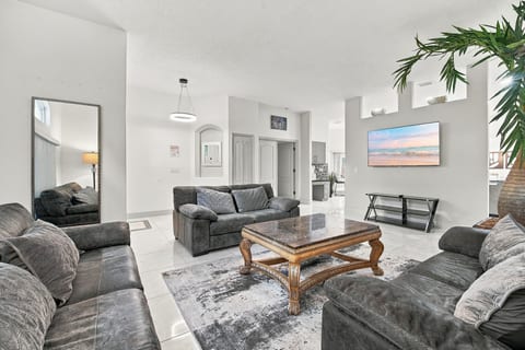 Bright, spacious living room with plush seating and an open layout