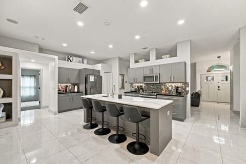 Bright modern kitchen with large island seating for five