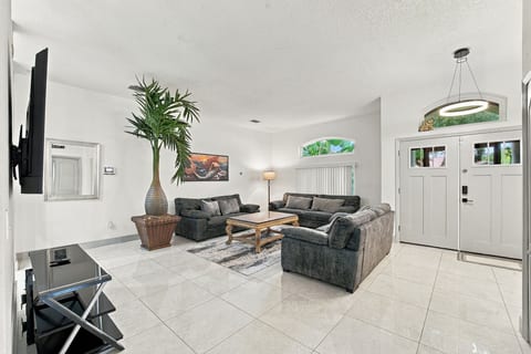 Bright open living room with high ceilings and stylish seating
