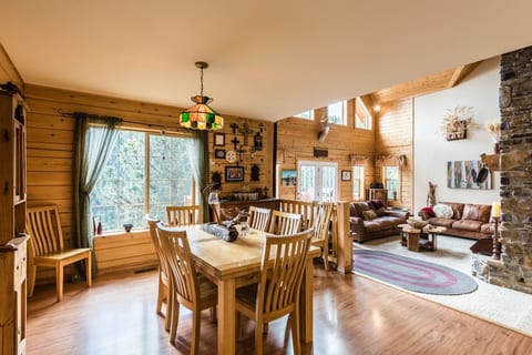 The dining room sits between the kitchen and living room, and has seating for 10