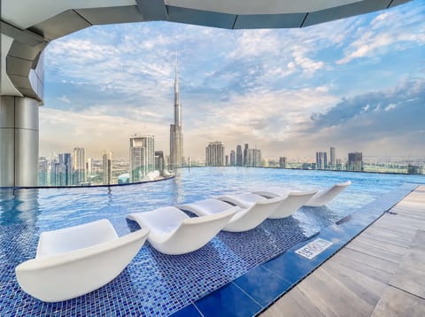 Rooftop infinity pool with skyline views and Burj Khalifa backdrop
