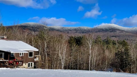 Cabin facing the mountains of the Brandon gap after a snow fall.