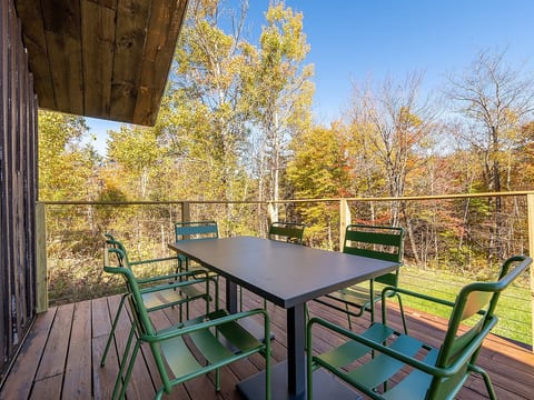 Deck with outdoor picnic table and chairs