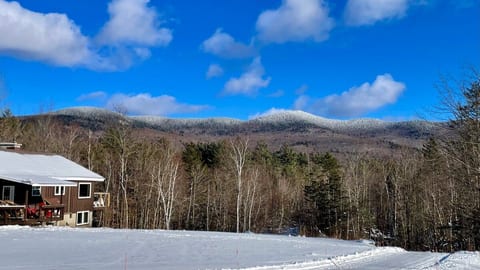 Cabin facing the mountains of the Brandon gap after a snow fall.