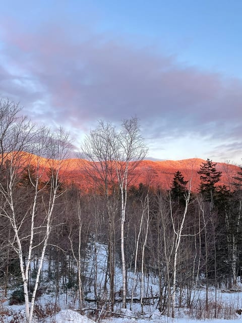 Winter "golden hour" as the sun sets across the mountains in the distance.