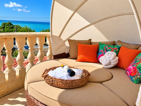 Sip morning coffee or relax on your inviting balcony daybed.