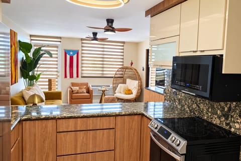 Modern open kitchen and cozy lounge with chic seating and bright natural light