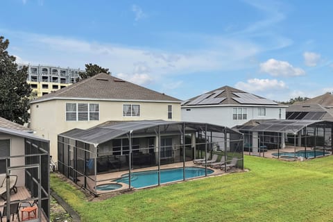Twin Mansions: Both homes and pools from the rear