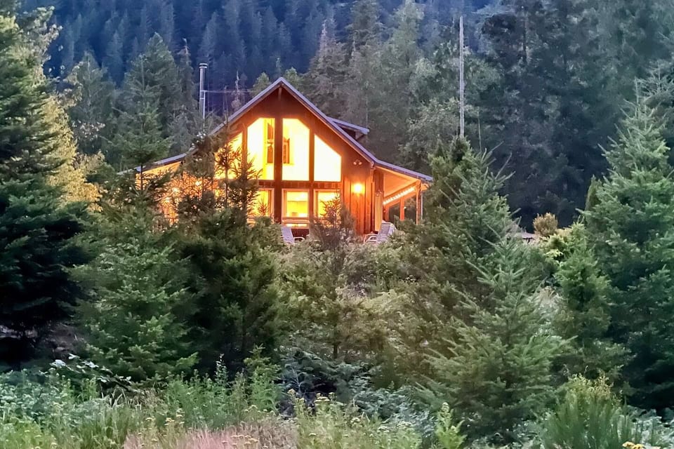 The view of the cabin at dusk. 