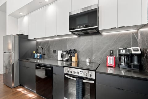 Sleek modern kitchen with premium appliances and stylish finishes
