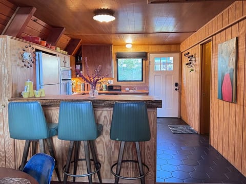 Pull a vintage leather stool up to the counter.