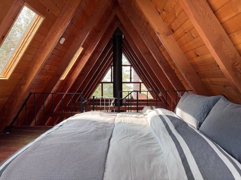 Cozy loft bedroom with skylights to gaze at the stars.
