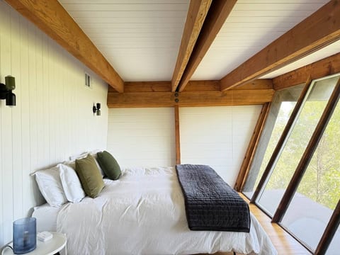 Organic soft satin-weave bedding. Down comforter and pillows. Extra pillows and blankets provided.