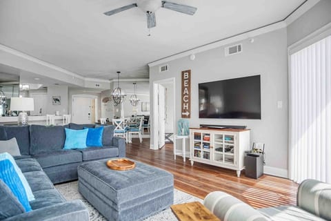 Spacious living area with sectional sleeper sofa and 65" Smart Cable TV with ocean views!