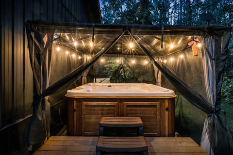 End the day with a private soak in the hot tub, tucked under a covered gazebo and surrounded by the quiet forest.