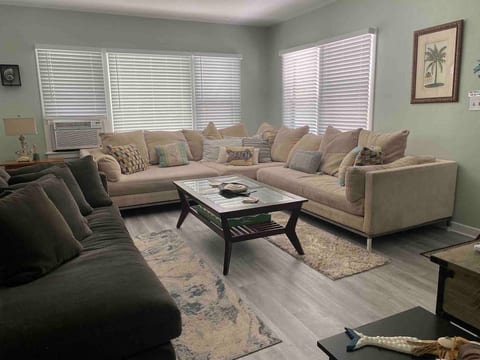Large living room with oversized sectional sofa and large chaise lounge
