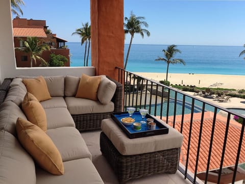 Patio overlooking the pool and the beach beyond