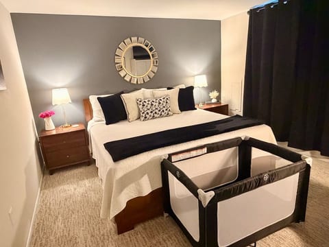 Spacious king bedroom with a Pack ’n Play available upon request, making the suite comfortable and convenient for families traveling with a little one.