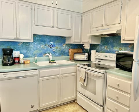 Fully stocked kitchen with coffee bar