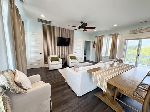 Bright, open living room with comfortable seating and coastal decor