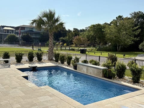 Spend your days relaxing by the private saltwater pool-the perfect Emerald Isle escape.