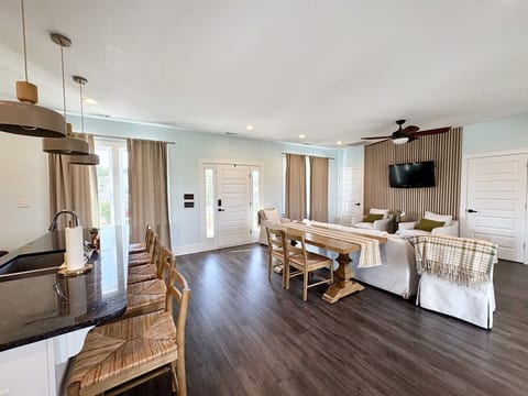 Open living area with easy access to dining and kitchen