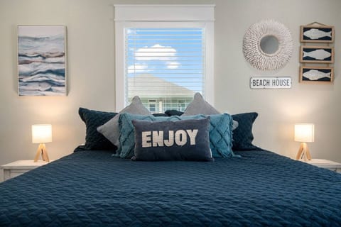 King bedroom with soft navy bedding