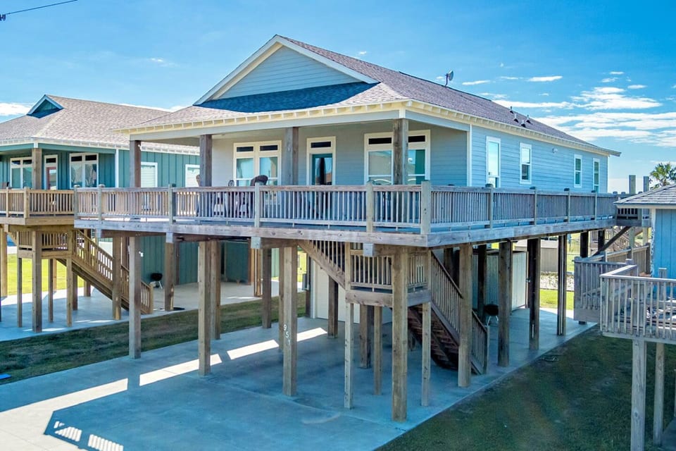 Raised beach house with a wraparound deck