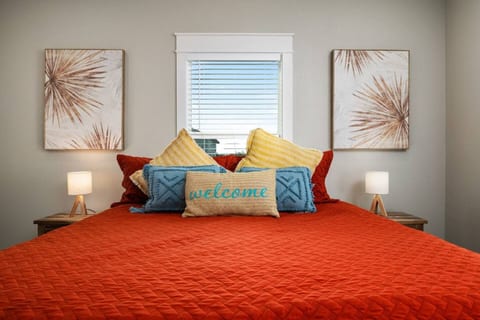 King bedroom with bright, cheerful bedding