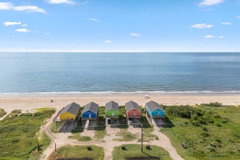 Aerial view: the blue house right on the beach