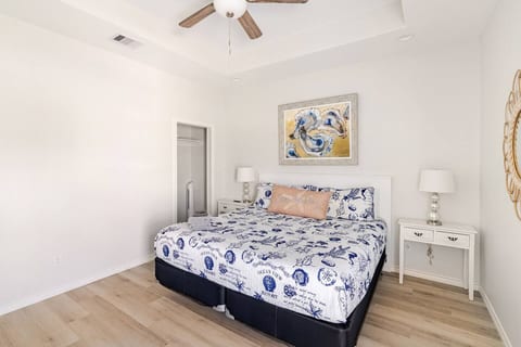 King bedroom with crisp coastal bedding