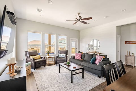 Bright living room with comfy seating and a smart TV