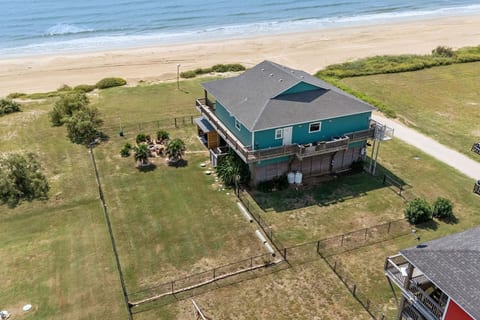 Right on the sand, with a fenced yard and fire pit
